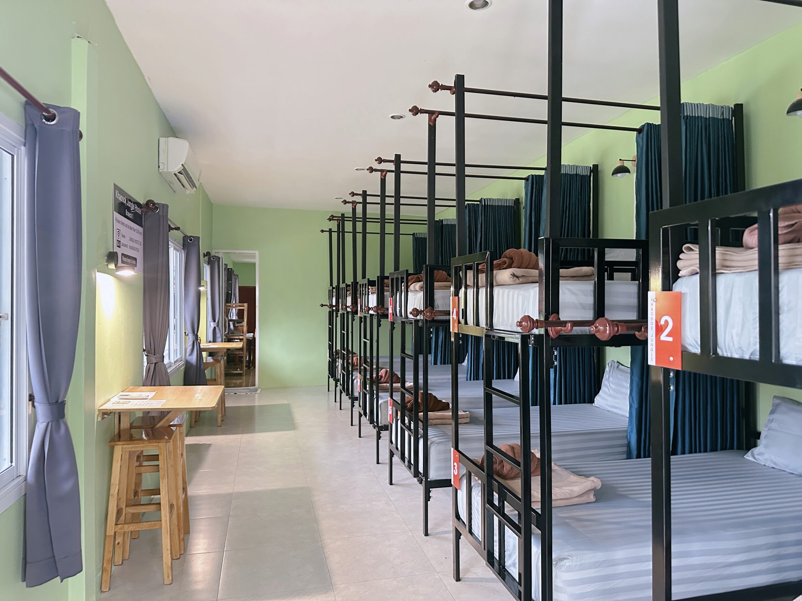 The basecamp for khao sok 3 days 2 nights tour with clean bunk beds and bright, communal seating area