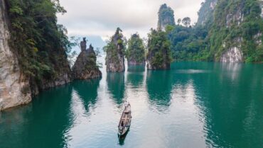 Limestone cliffs rising above the waters of Cheow Lan Lake in Khao Sok National Park