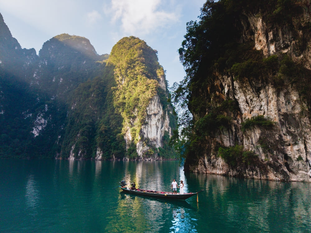 Tour boat crossing Cheow Lan Lake, the start of every Khao Sok day trip and overnight tour