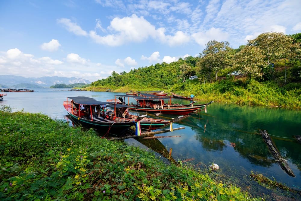 Long-tail boats on Cheow Lan Lake. A Khao Lak to Khao Sok trip for this calls for a long travel day.