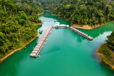 A raft house among the Khao Sok floating bungalows on calm Cheow Lan Lake water