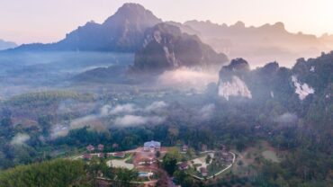 The jungle landscape near Khao Sok village, framed by towering karst cliffs